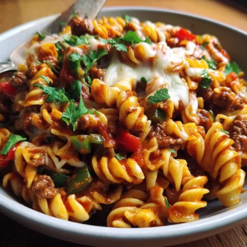 one pot beef taco pasta with cheese and toppings
